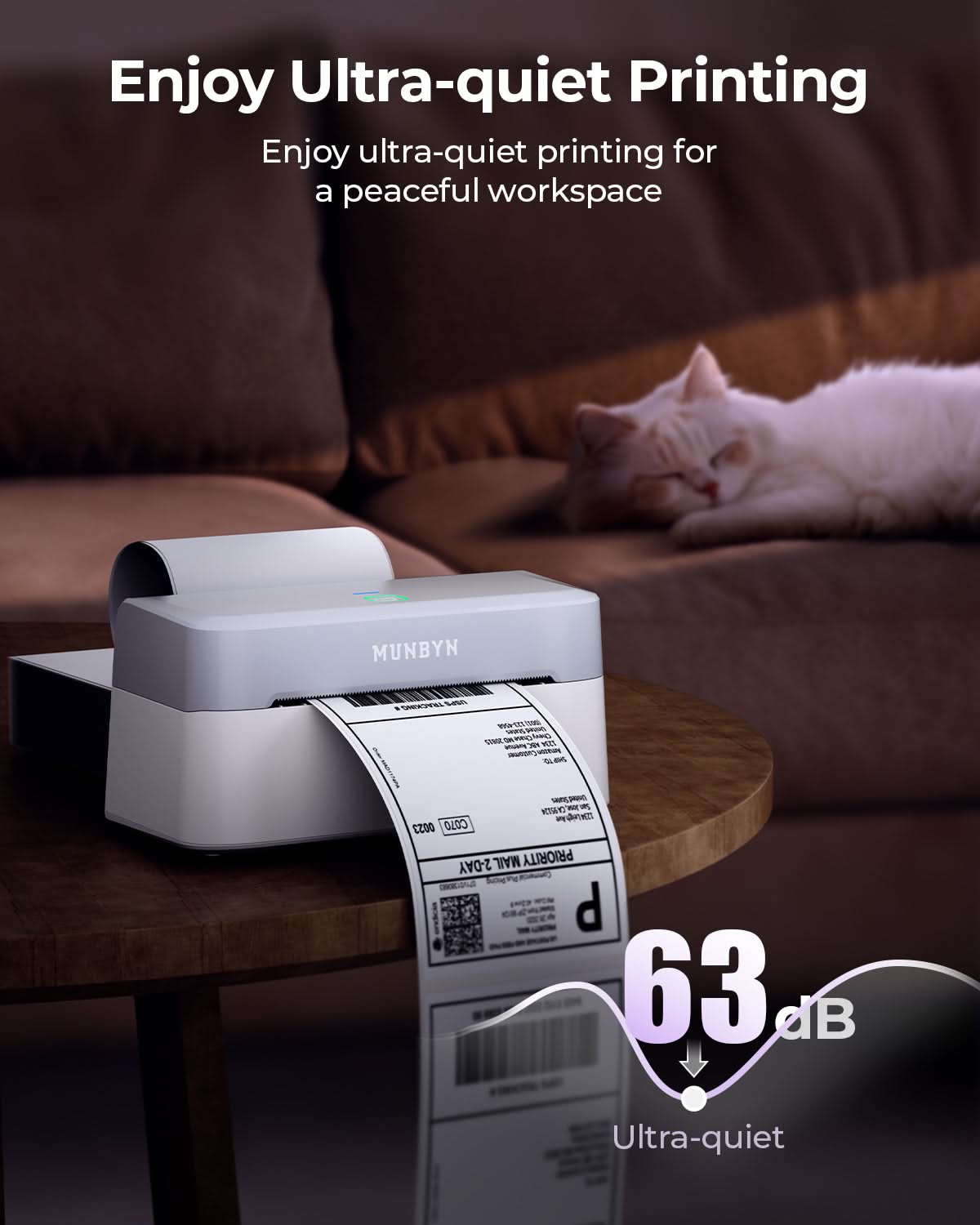 MUNBYN RealWriter 403B thermal label printer printing on a label with connected power and data cables visible