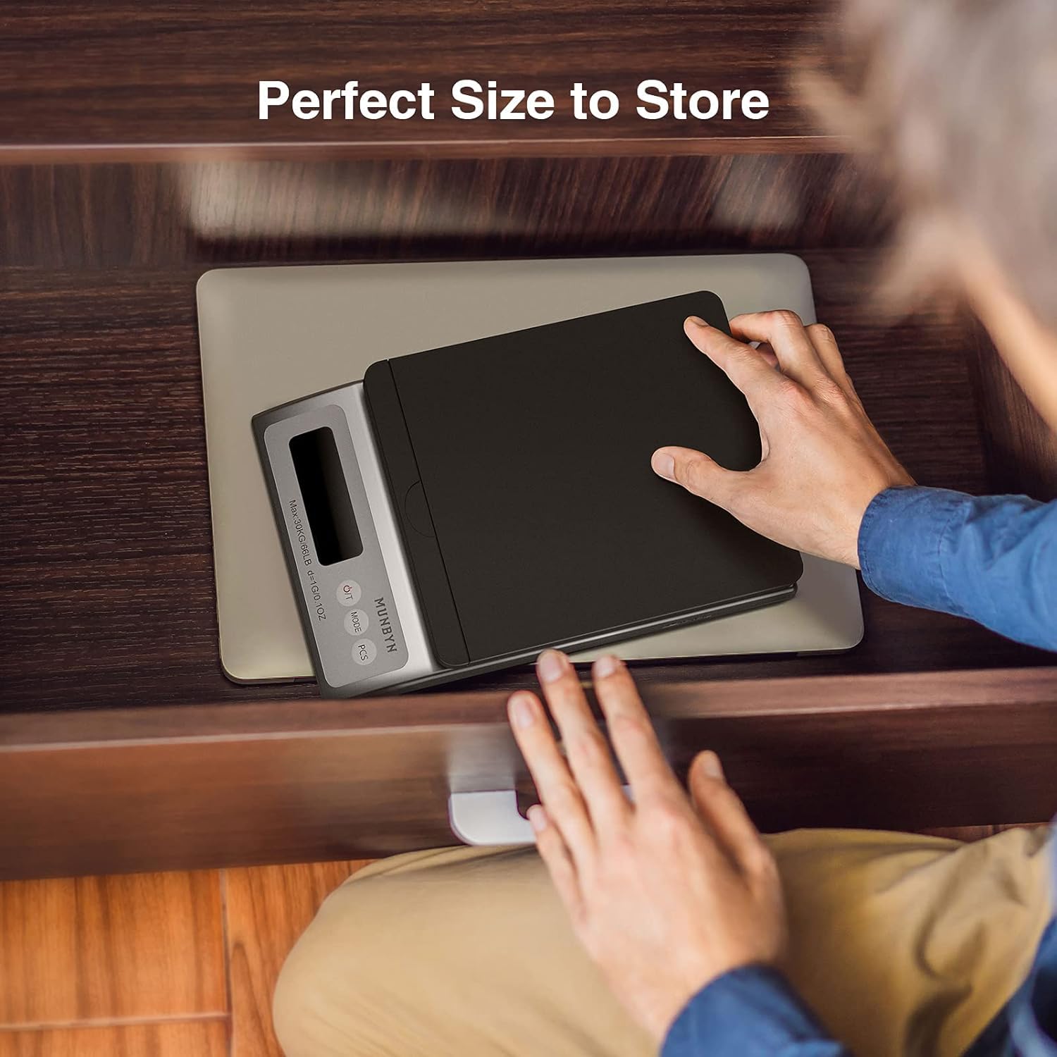 Black MUNBYN IPS01 postal scale used as a label printer accessory, showing the digital display and compact design.