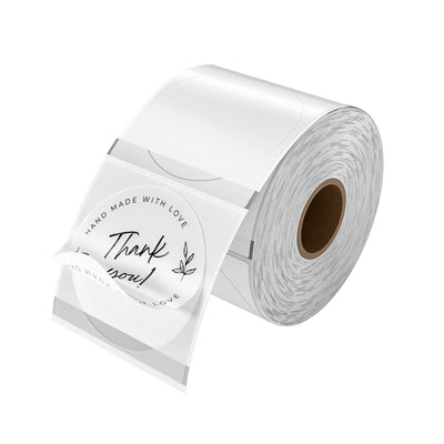 Two-inch clear labels printed on MUNBYN label printer paper, showing transparent adhesive labels in a close-up view.