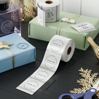 Clear 2-inch labels for label printer paper by MUNBYN, shown in sheets ready for printing and organization.