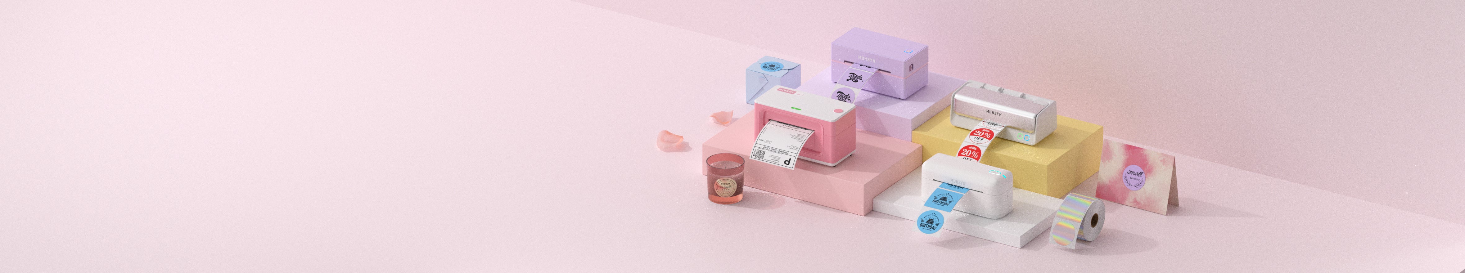 Collection of MUNBYN thermal printers and labels on a pink background