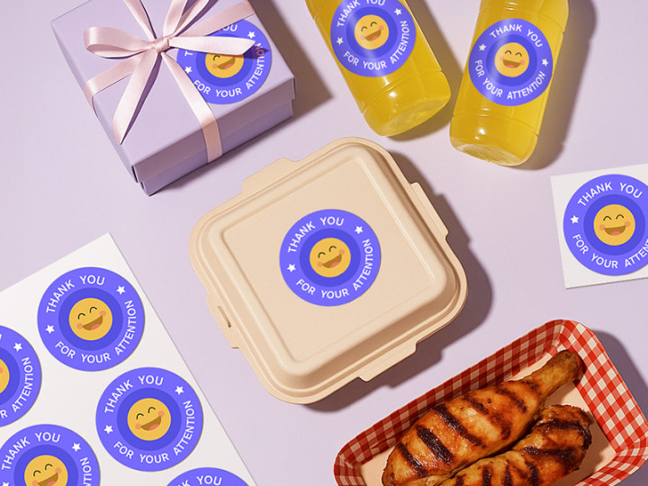 Stickers with a smiley face design and text 'Thank you for your attention' on various items including a box, bottle, and food container.